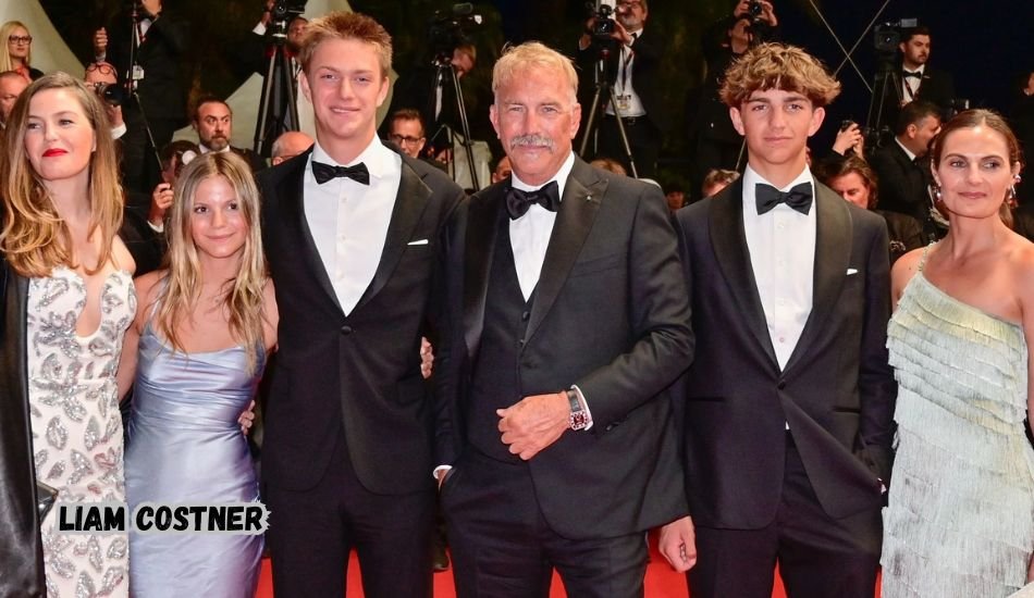 Liam Costner smiling during a film premiere event.